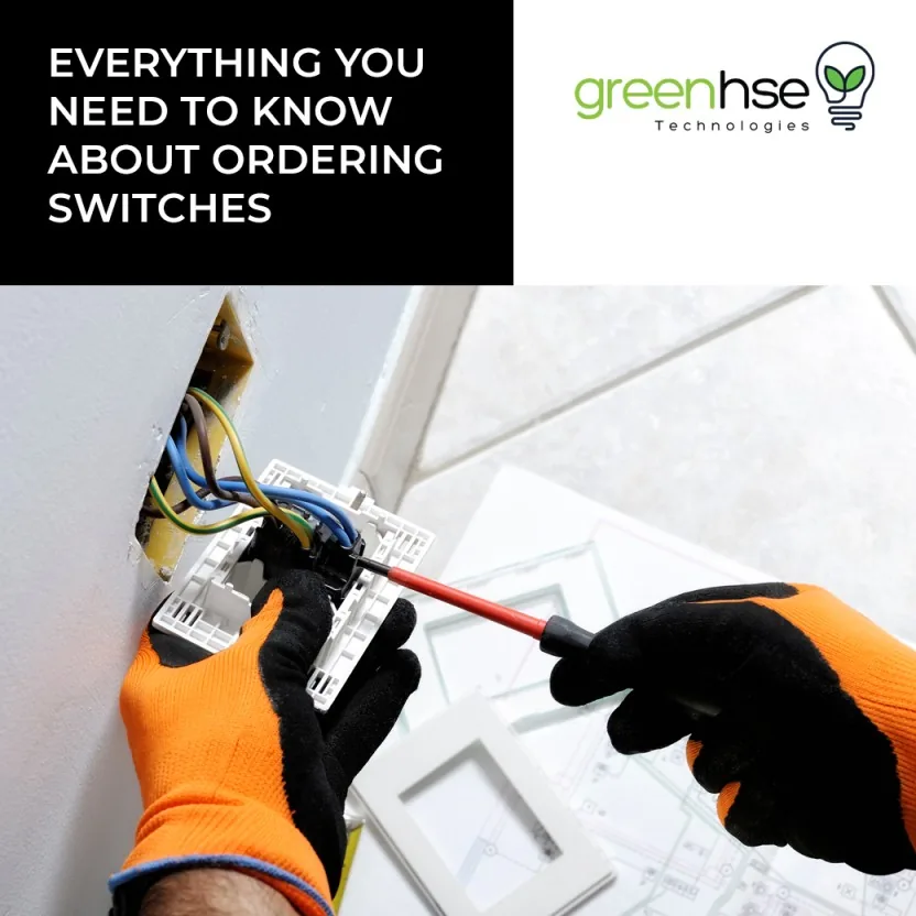 Electrician wiring a crystal glass switch plate into a wall box in a Perth home