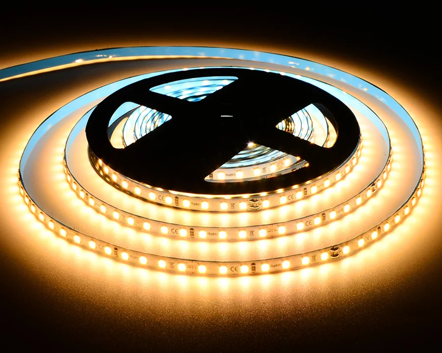 24V High Lumen SMD 12W/m strip light on the reel, lit warm white
